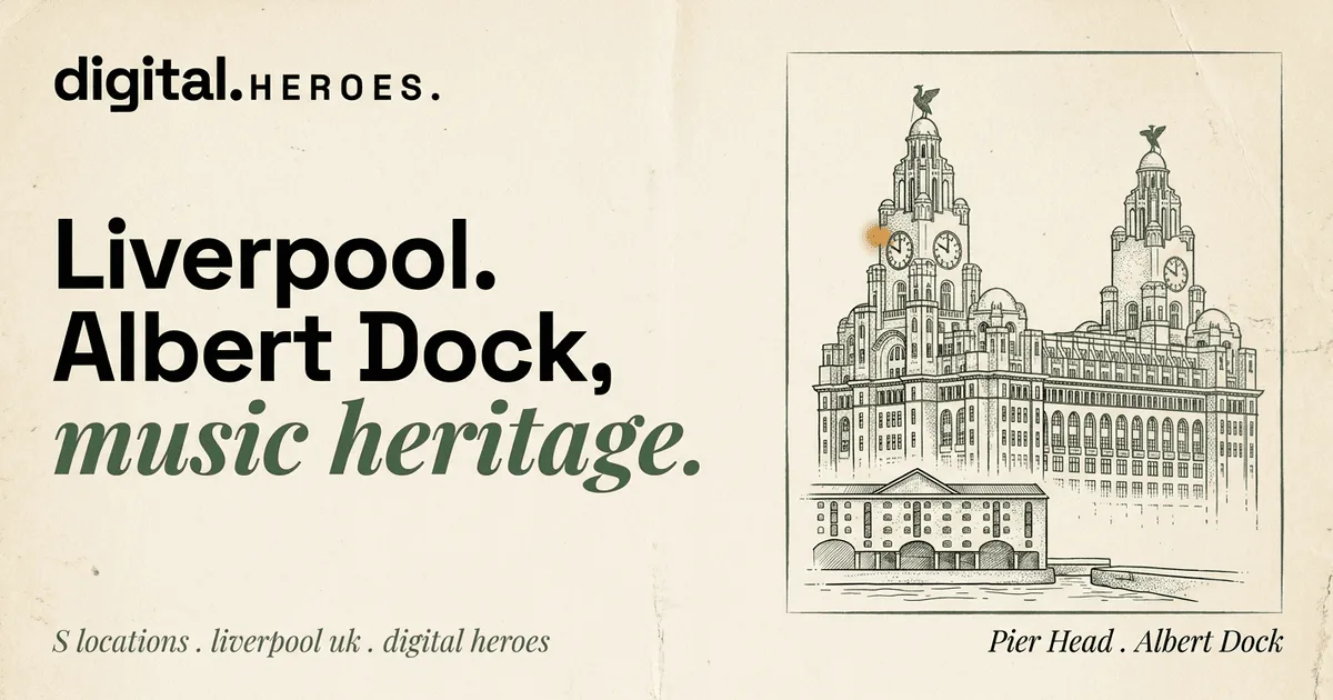 Royal Liver Building twin clock-tower facade with Liver Bird silhouettes and a dock warehouse — Digital Heroes Shopify development for Liverpool clients